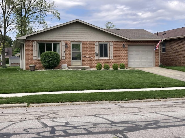 404 W Harrison Sts, Monticello, IN 47960 - ranch-style house featuring concrete driveway, brick siding, an attached garage, and a front lawn