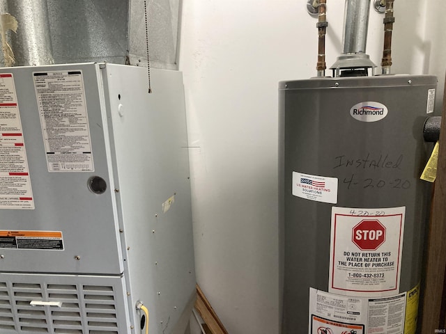 404 W Harrison Sts, Monticello, IN 47960 - utility room featuring gas water heater and heating unit