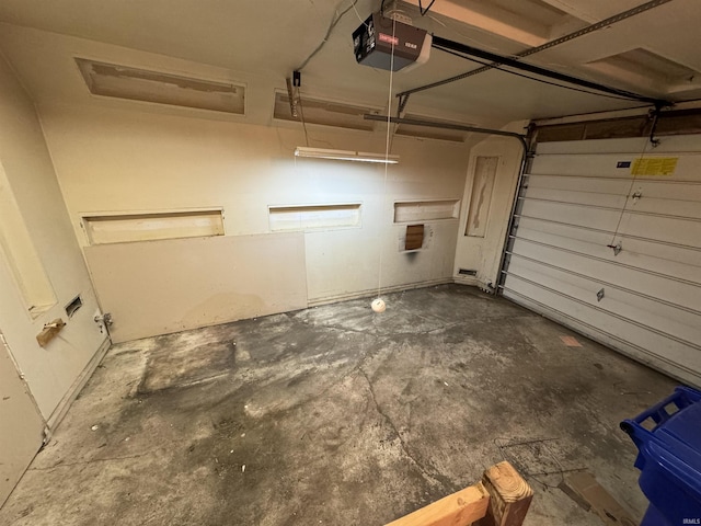 garage featuring a garage door opener