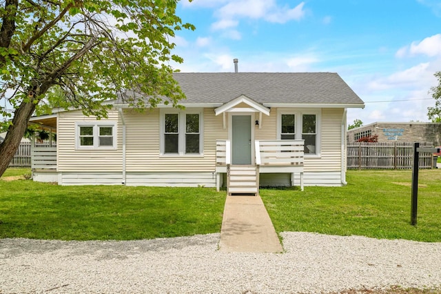 bungalow-style house with a shingled roof