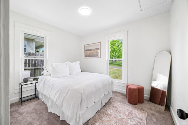 bedroom with carpet flooring and baseboards