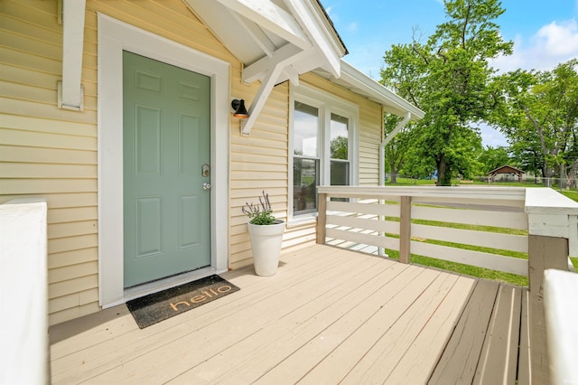 property entrance featuring a wooden deck