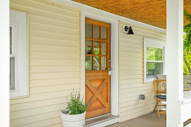 doorway to property featuring covered porch