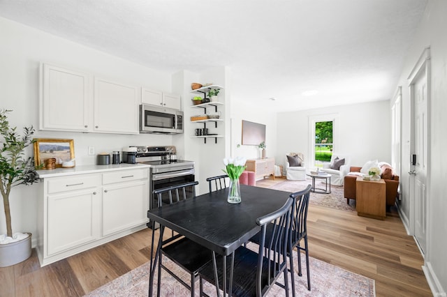 dining area with light wood finished floors