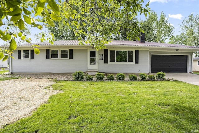 8020 Marston Dr, Fort Wayne, IN 46835 - single story home featuring a garage, concrete driveway, a front lawn, and metal roof