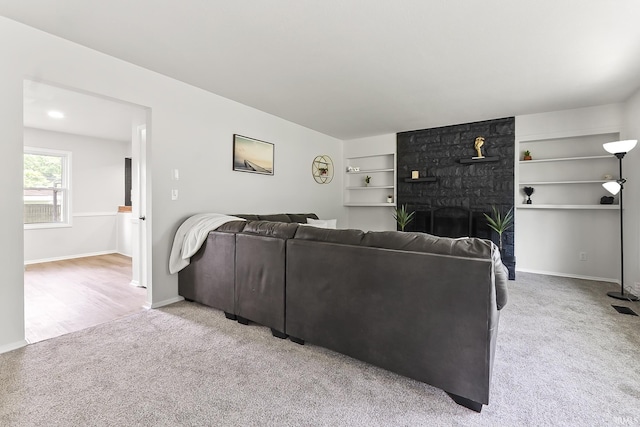 8020 Marston Dr, Fort Wayne, IN 46835 - living room featuring built in shelves, light colored carpet, and baseboards