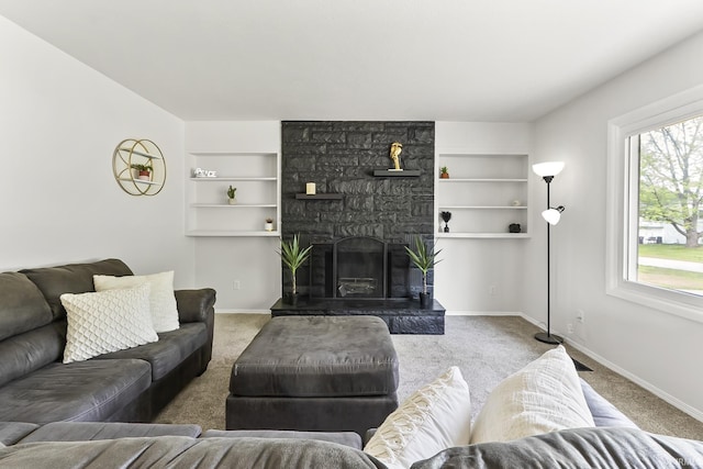 8020 Marston Dr, Fort Wayne, IN 46835 - carpeted living area with built in shelves, baseboards, and a fireplace