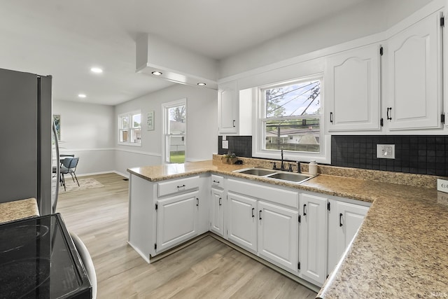 8020 Marston Dr, Fort Wayne, IN 46835 - kitchen featuring a sink, freestanding refrigerator, black electric range oven, light wood finished floors, and recessed lighting