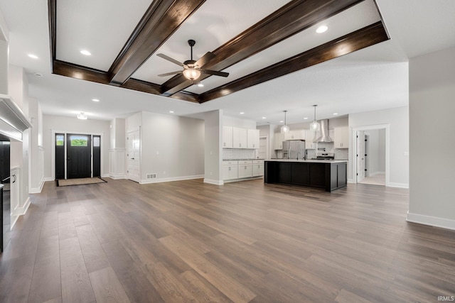 13335 Passerine Blvd, Fort Wayne, IN 46845 - unfurnished living room featuring a ceiling fan, dark wood finished floors, recessed lighting, baseboards, and beam ceiling