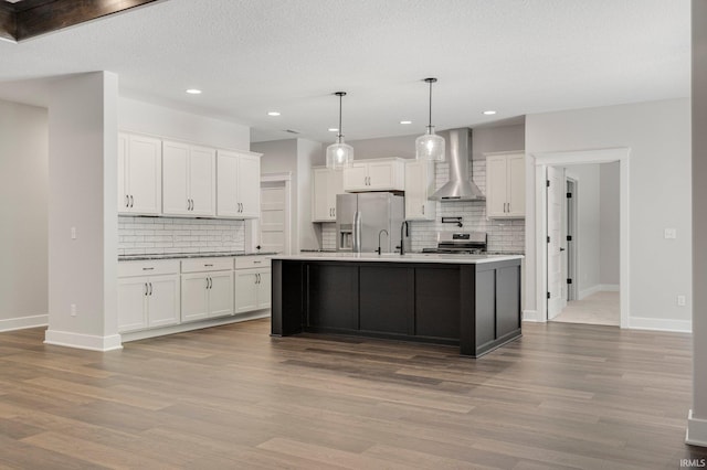 13335 Passerine Blvd, Fort Wayne, IN 46845 - kitchen with wall chimney range hood, stainless steel appliances, tasteful backsplash, baseboards, and recessed lighting