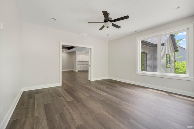 13335 Passerine Blvd, Fort Wayne, IN 46845 - spare room featuring dark wood-style flooring, baseboards, and ceiling fan