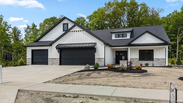 13335 Passerine Blvd, Fort Wayne, IN 46845 - modern inspired farmhouse featuring stone siding, roof with shingles, a garage, concrete driveway, and board and batten siding