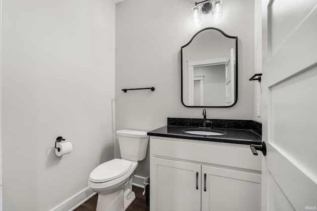 13335 Passerine Blvd, Fort Wayne, IN 46845 - half bath featuring toilet, vanity, baseboards, and wood finished floors