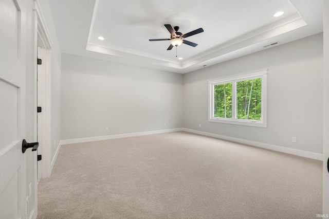 13335 Passerine Blvd, Fort Wayne, IN 46845 - spare room featuring a raised ceiling, recessed lighting, light colored carpet, a ceiling fan, and baseboards
