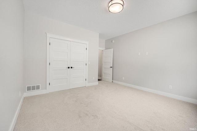 13335 Passerine Blvd, Fort Wayne, IN 46845 - unfurnished bedroom featuring light colored carpet, a closet, and baseboards