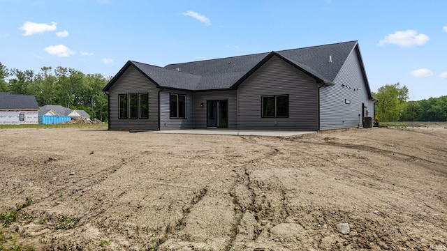 13335 Passerine Blvd, Fort Wayne, IN 46845 - back of house featuring central air condition unit, a patio area, and a shingled roof