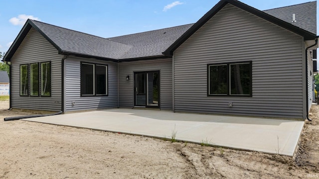 13335 Passerine Blvd, Fort Wayne, IN 46845 - rear view of house with roof with shingles and a patio area