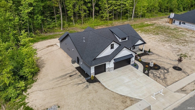 13335 Passerine Blvd, Fort Wayne, IN 46845 - aerial view of property and surrounding area with a forest