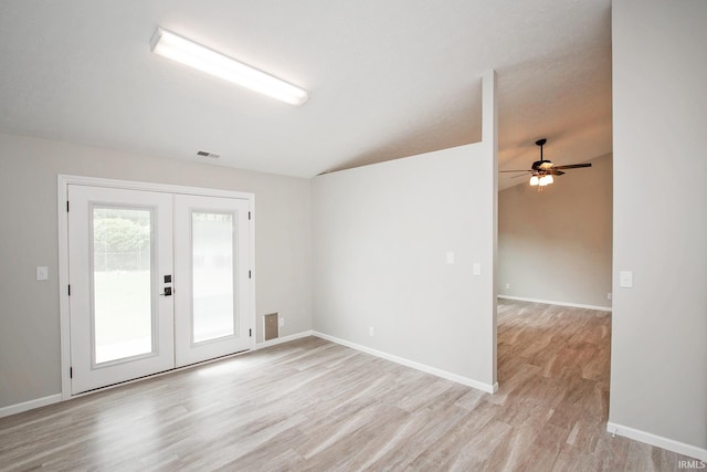 4335 Hadley Ct, West Lafayette, IN 47906 - spare room with french doors, light wood-style floors, ceiling fan, baseboards, and lofted ceiling