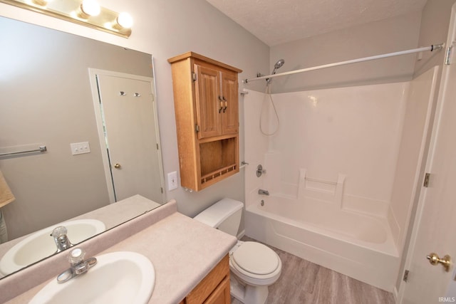4335 Hadley Ct, West Lafayette, IN 47906 - full bathroom with wood finished floors, toilet, shower / bath combination, vanity, and a textured ceiling