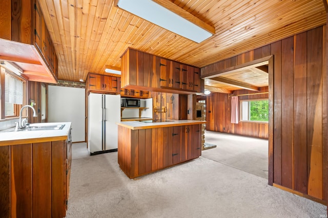 4837 Covered Bridge Rd, Nashville, IN 47448 - kitchen featuring freestanding refrigerator, black microwave, wooden ceiling, light carpet, and a sink