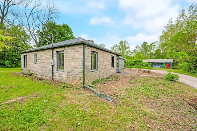 4837 Covered Bridge Rd, Nashville, IN 47448 - view of side of home featuring stone siding, a lawn, and dirt driveway