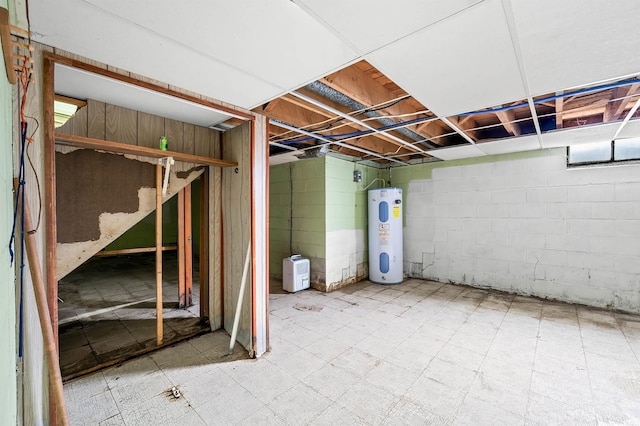 4837 Covered Bridge Rd, Nashville, IN 47448 - unfinished below grade area with electric water heater and tile patterned floors