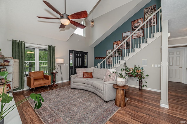 845 N Timberline Cir E, Warsaw, IN 46582 - living room featuring stairs, ceiling fan, wood finished floors, baseboards, and high vaulted ceiling