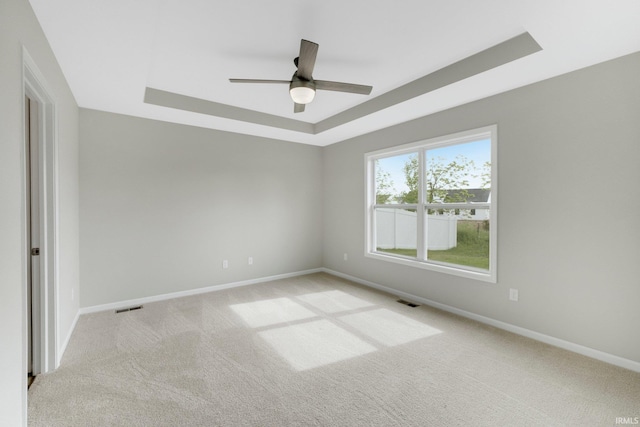 7696 Lila Way, Fort Wayne, IN 46835 - spare room featuring a raised ceiling, ceiling fan, carpet flooring, and baseboards