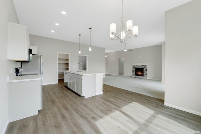 7696 Lila Way, Fort Wayne, IN 46835 - kitchen featuring light countertops, white cabinetry, light wood-style floors, a sink, and recessed lighting