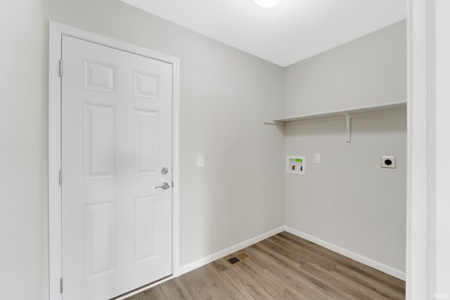 7696 Lila Way, Fort Wayne, IN 46835 - laundry room with light wood-style floors, washer hookup, electric dryer hookup, and baseboards