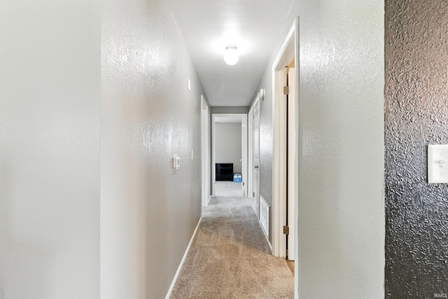 7205 Eby Rd, Fort Wayne, IN 46835 - hall featuring light colored carpet and baseboards