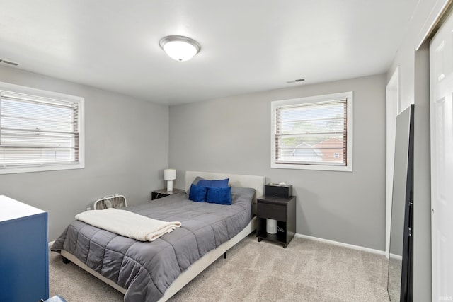 7205 Eby Rd, Fort Wayne, IN 46835 - bedroom featuring light colored carpet, multiple windows, and baseboards