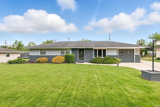 7205 Eby Rd, Fort Wayne, IN 46835 - ranch-style home with a front lawn, an attached garage, concrete driveway, and roof with shingles