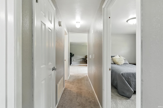 7205 Eby Rd, Fort Wayne, IN 46835 - hallway featuring carpet floors, a textured wall, and baseboards