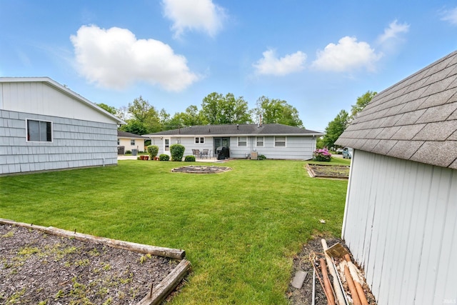 7205 Eby Rd, Fort Wayne, IN 46835 - view of green lawn featuring a garden