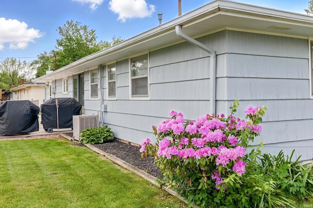 7205 Eby Rd, Fort Wayne, IN 46835 - view of property exterior with central AC and a lawn