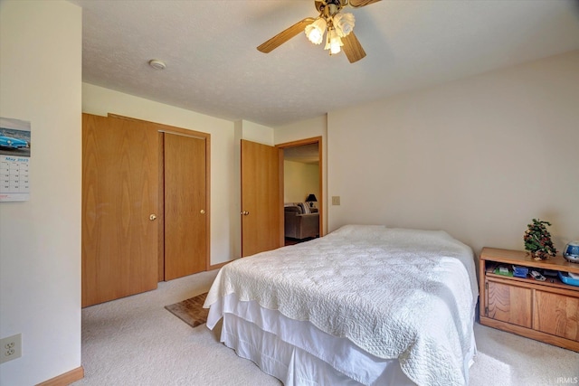 7373 Locust Lake Rd, Spencer, IN 47460 - bedroom with light colored carpet, a closet, and a ceiling fan