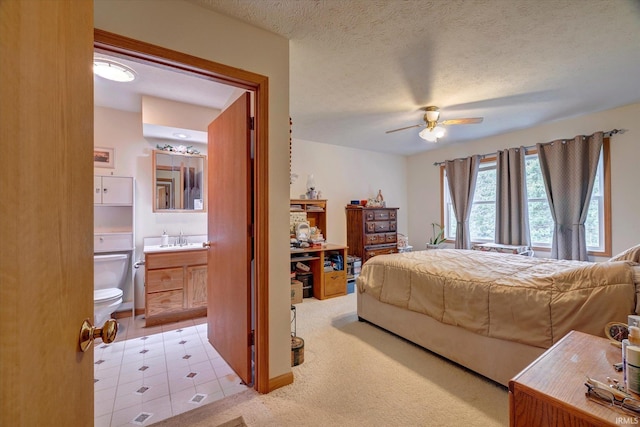 7373 Locust Lake Rd, Spencer, IN 47460 - bedroom with a sink, light colored carpet, connected bathroom, a ceiling fan, and a textured ceiling
