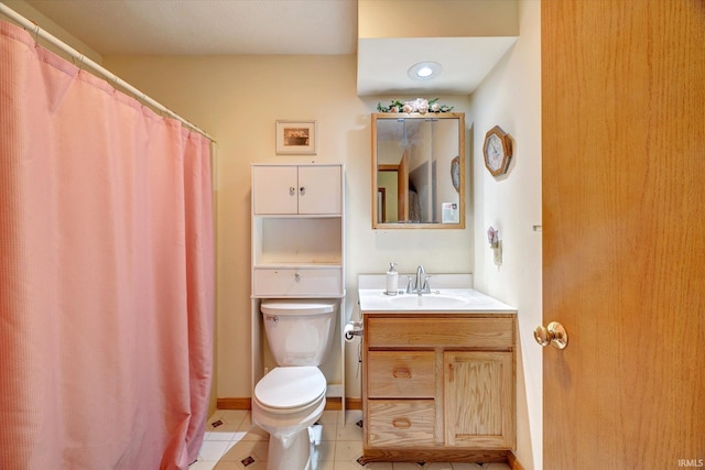 7373 Locust Lake Rd, Spencer, IN 47460 - bathroom with toilet, vanity, tile patterned floors, and baseboards