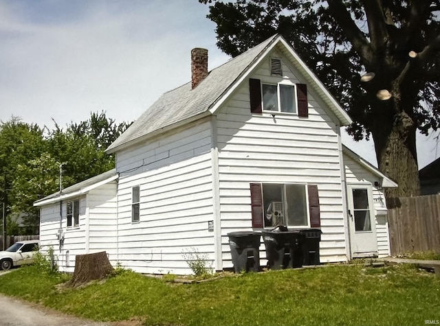 view of side of property with a chimney