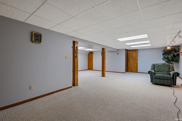 608 Fieldstone Ln, Middlebury, IN 46540 - finished basement with a drop ceiling, light carpet, and baseboards