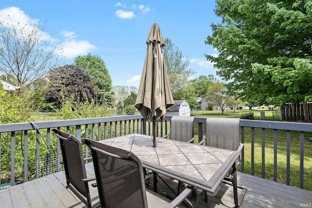 608 Fieldstone Ln, Middlebury, IN 46540 - deck with outdoor dining space and a lawn