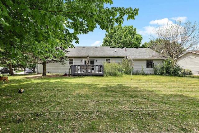 608 Fieldstone Ln, Middlebury, IN 46540 - back of house featuring a lawn and a deck