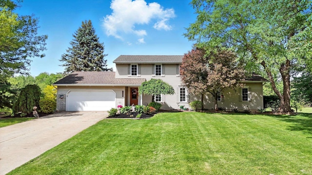 view of front facade with a garage, a front yard, and driveway