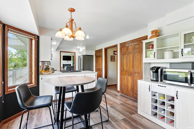 dining room featuring a chandelier and wood finished floors
