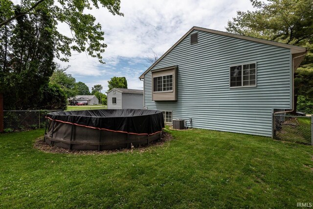3879 Woodmere Way, Bloomington, IN 47403 - back of house with cooling unit