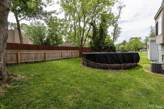 3879 Woodmere Way, Bloomington, IN 47403 - view of yard featuring central AC and a swimming pool