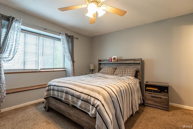 3879 Woodmere Way, Bloomington, IN 47403 - carpeted bedroom with baseboards and a ceiling fan
