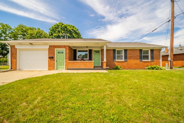 24 E Jackson St, Knightstown, IN 46148 - single story home featuring an attached garage, driveway, brick siding, a front yard, and a porch